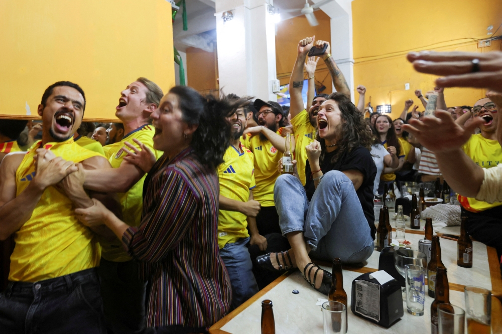 Colombia fans react as they watch the 2026 Fifa World Cup match between Uzbekistan and Colombia at a restaurant in Mexico City June 17, 2026. — Reuters pic