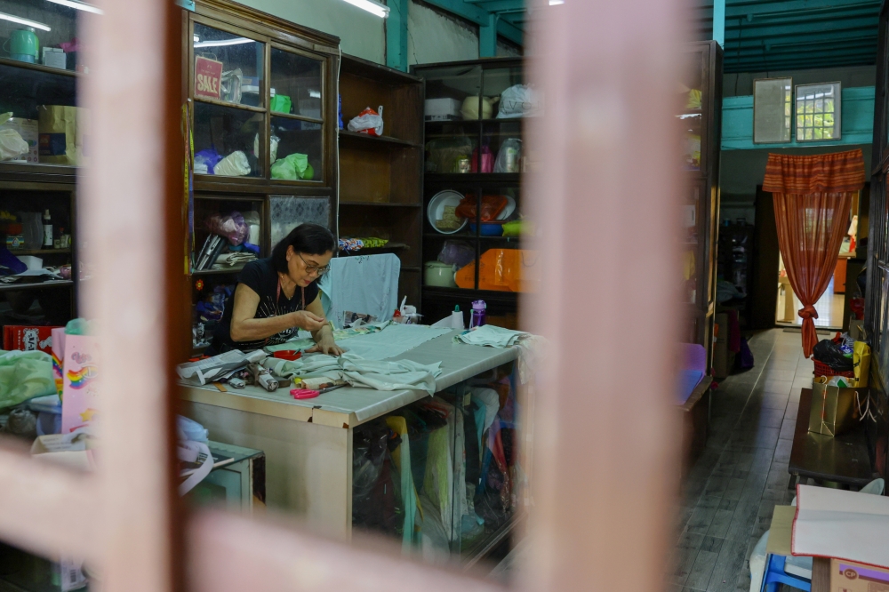 Gau Mekhua, 73, continues to run her decades-old tailoring business in Kampung Cina, Kuala Terengganu in June 2026 in the face of cheap, ready-made clothing  from modern boutiques. — Bernama pic