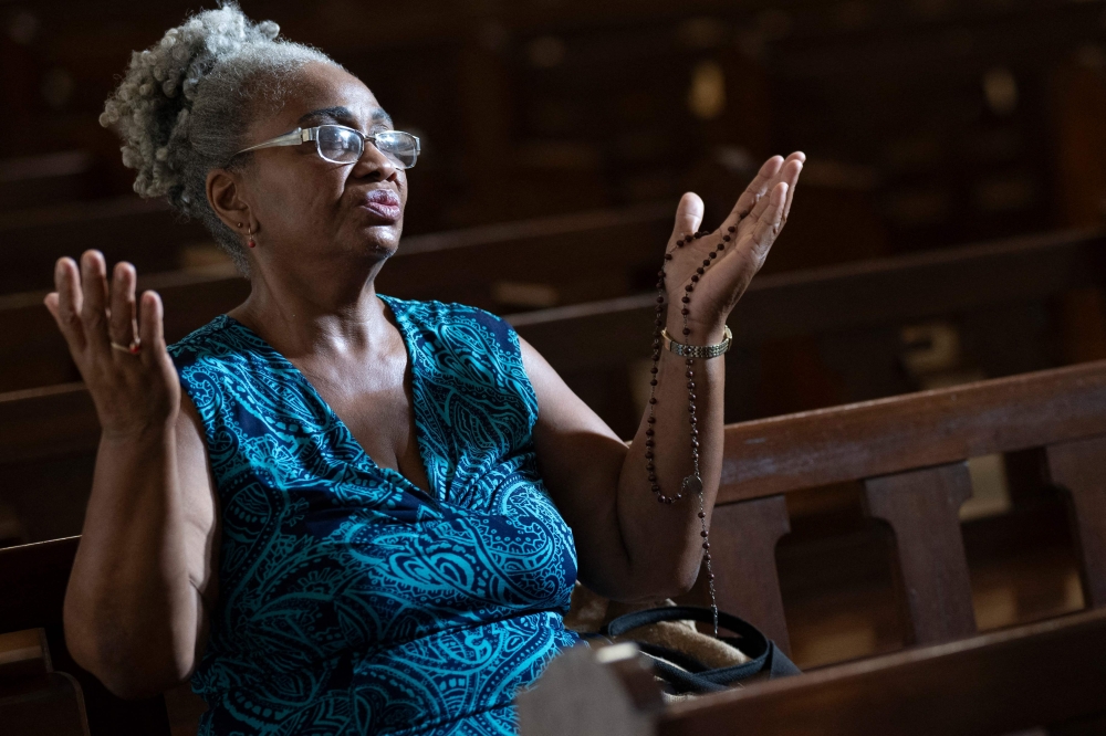 A woman prays before a Mass at the chapel of the Santa Teresa and San Jose Convent in the Vedado neighbourhood of Havana, Cuba on June 14, 2026. — AFP pic