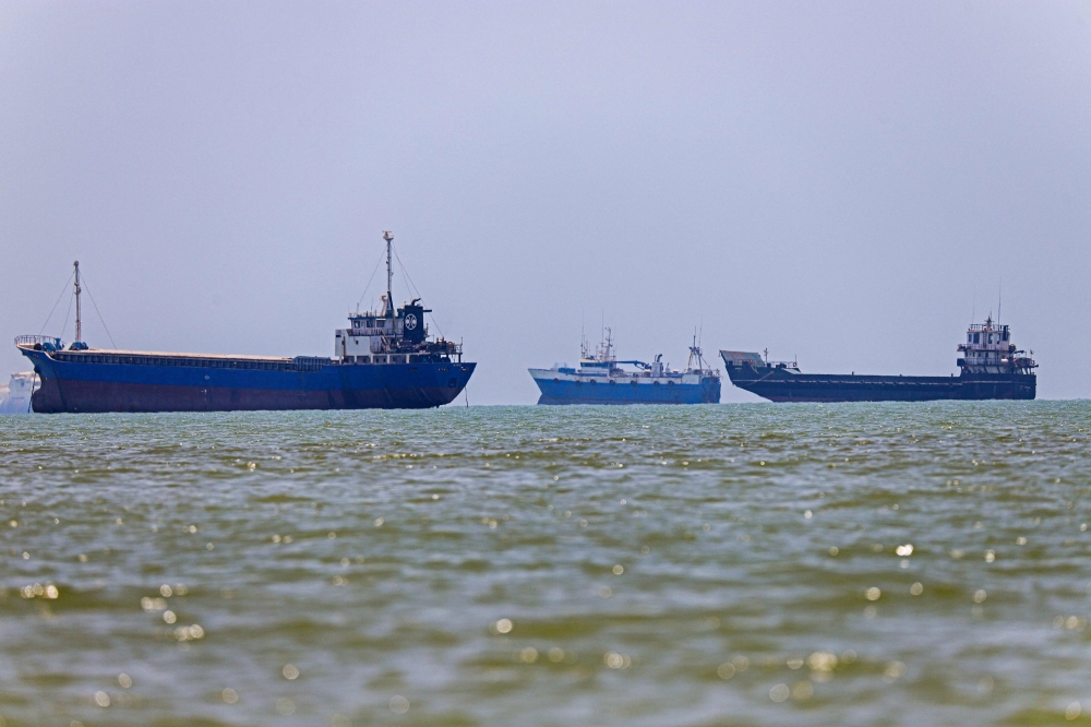 Ships are seen anchored in Bandar Abbas along the Strait of Hormuz, a strategic waterway that carries about a fifth of the world's oil supplies and remains vulnerable to disruption amid tensions in West Asia, on June 18, 2026. — ISNA/AFP pic