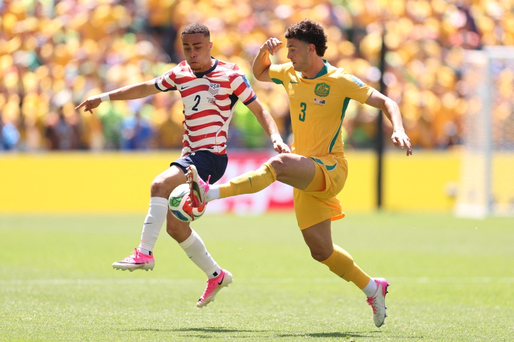 US reach World Cup last 32 with win over Australia as Scotland stumble