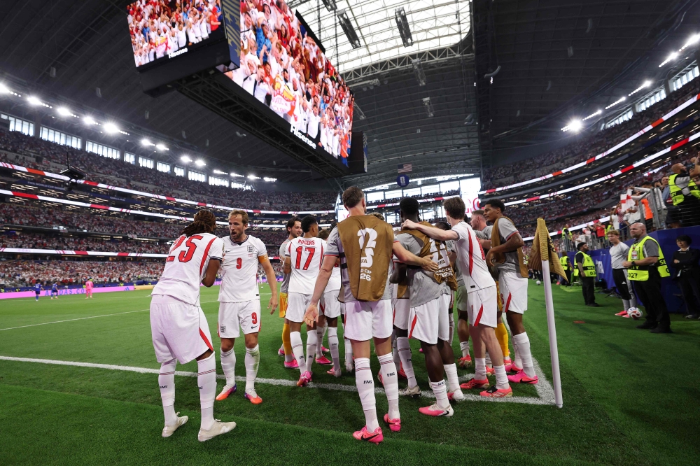 England’s Djed Spence (left) and Harry Kane celebrate Marcus Rashford’s fourth goal against Croatia, with the team’s hot pink boots reflecting one of the World Cup’s biggest style trends, in Dallas June 17, 2026. — AFP pic