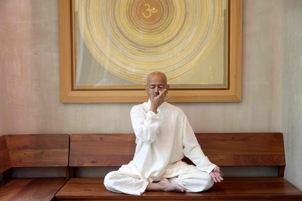 Varun Veer, founder of Lifeyoga, demonstrates 'Pranayama' at his studio in New Delhi on June 19, 2026. Yoga is a millennia-old practice that is physical, mental and spiritual. But Indian yoga expert and teacher Varun Veer warned ahead of International Yoga Day, set for June 21, that its Western form is often reduced to the physical dimension. — AFP pic