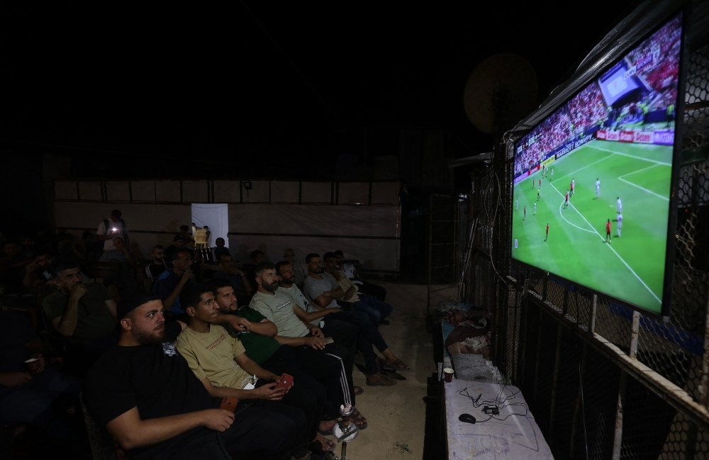 Owners of the small makeshift cafes that have sprung up across the Palestinian territory are doing their best to try to recreate the atmosphere of previous major tournaments. — AFP pic
