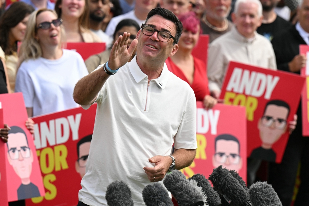 New Labour MP Andy Burnham speaks to supporters and media after his Makerfield by‑election win, at Ashton Town FC in north‑west England on June 19, 2026. — AFP pic