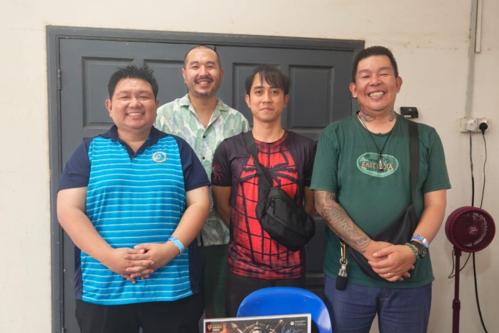 (From left) Abel, Ian, Shahrizal and Martin are all smiles when met at the Sabah National Tabletop Con 2.0. — The Borneo Post pic