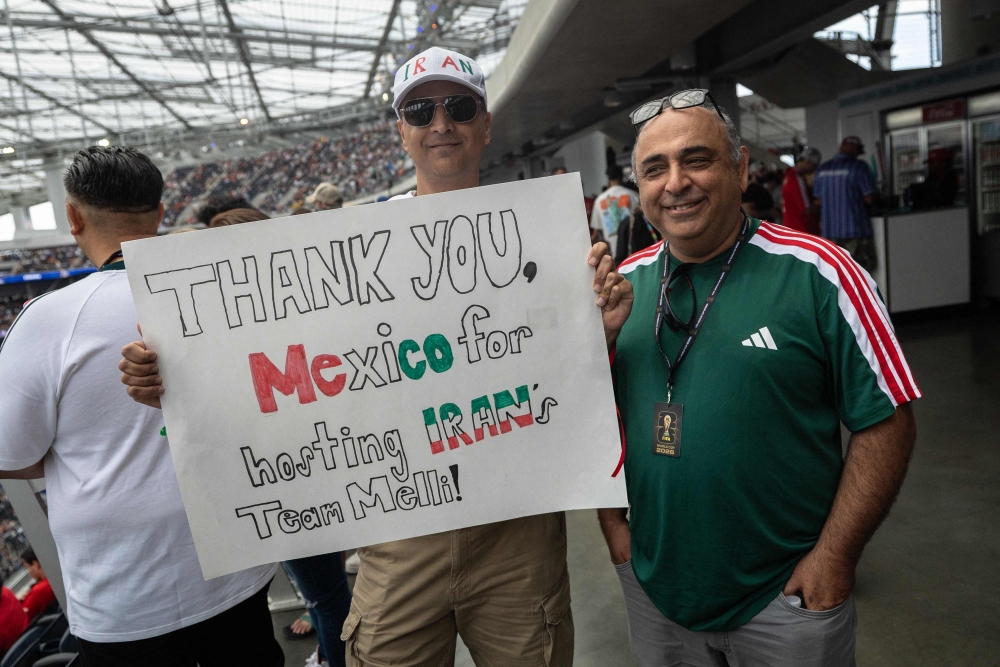 Iranian fans show a sign that reads ‘Thank you, Mexico for hosting Iran’s team Melli’ ahead of the 2026 World Cup Group G football match between Belgium and Iran at the Los Angeles Stadium in Inglewood on June 21, 2026. — AFP pic