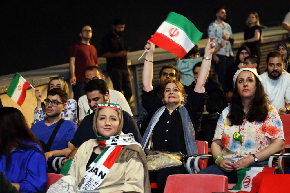 Iranian football watch a broadcast of the 2026 World Cup Group G football match between Belgium and Iran in Tehran June 21, 2026. — AFP pic