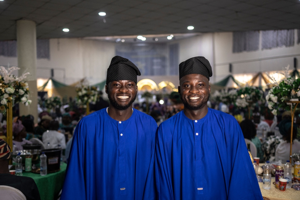 Twin brothers pose for a photograph as they attend the wedding reception of twin brothers Taiwo and Kehinde Oguntoye and twin sisters Taiwo and Kehinde Adediran at the International Conference Center in Ibadan June 20, 2026. — AFP pic