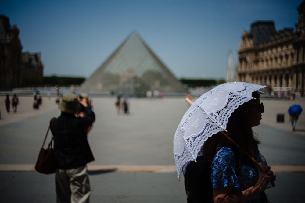 ‘Paris in this heat is awful’: Tourists change plans as sites close early