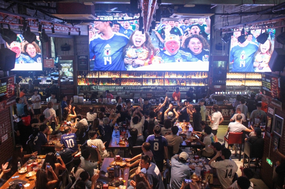 Chinese fans watch Japan’s World Cup match against Tunisia at a sports bar in Shanghai June 21, 2026. — AFP pic