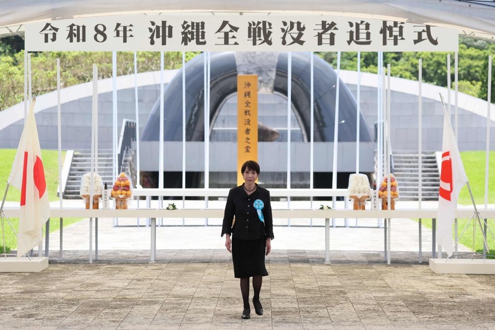 Japan pacifists heckle PM Takaichi at Okinawa WWII shrine