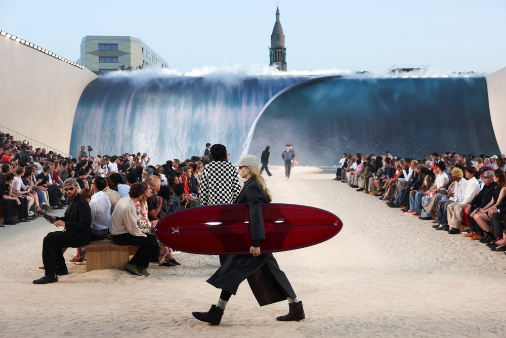 When Paris hits 40°C, Pharrell builds a waterfall for Louis Vuitton Men’s Spring-Summer 2027 show