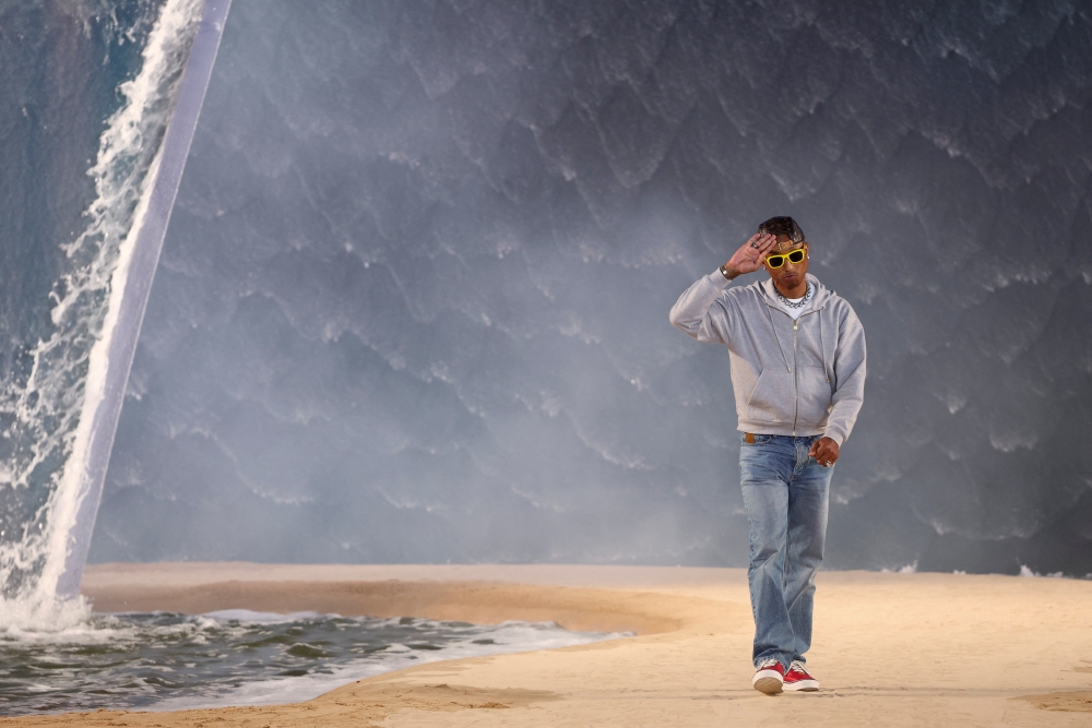 Designer and musician Pharrell Williams appears at the end of his Menswear Spring-Summer 2027 collection show for Louis Vuitton during Men’s Fashion Week in Paris June 23, 2026. — Reuters pic