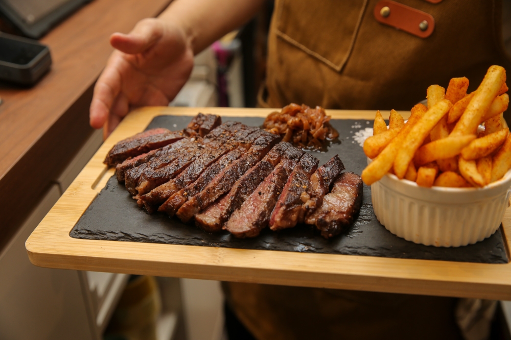 Despite working in some of Singapore’s finest restaurants, the couple are adamant that they want Nude to remain a casual, ‘bistro’-style place, with dishes like steak 'frites' on the menu. — Picture by Choo Choy May
