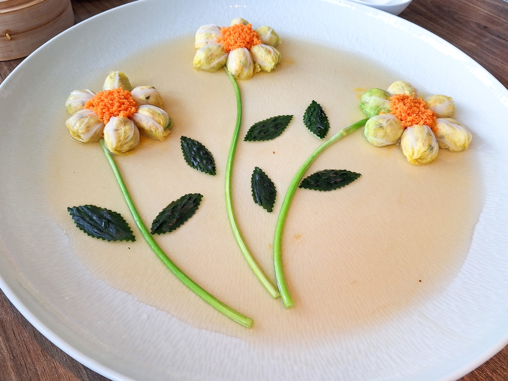 Cuttlefish balls wrapped in vegetables is creatively presented here as flower stalks with cucumber slices as ‘leaves’. — Picture by Ida Lim