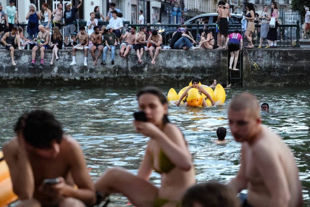 Europe’s heatwave intensifies as record temperatures strain hospitals and trigger bans