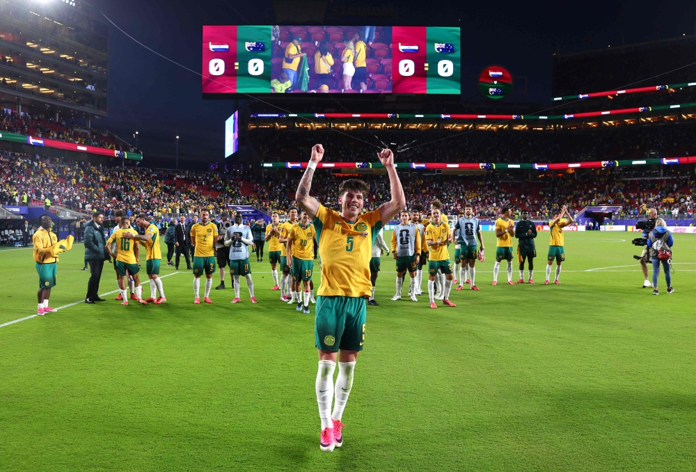 Australia grind out draw with Paraguay to reach World Cup knockout rounds