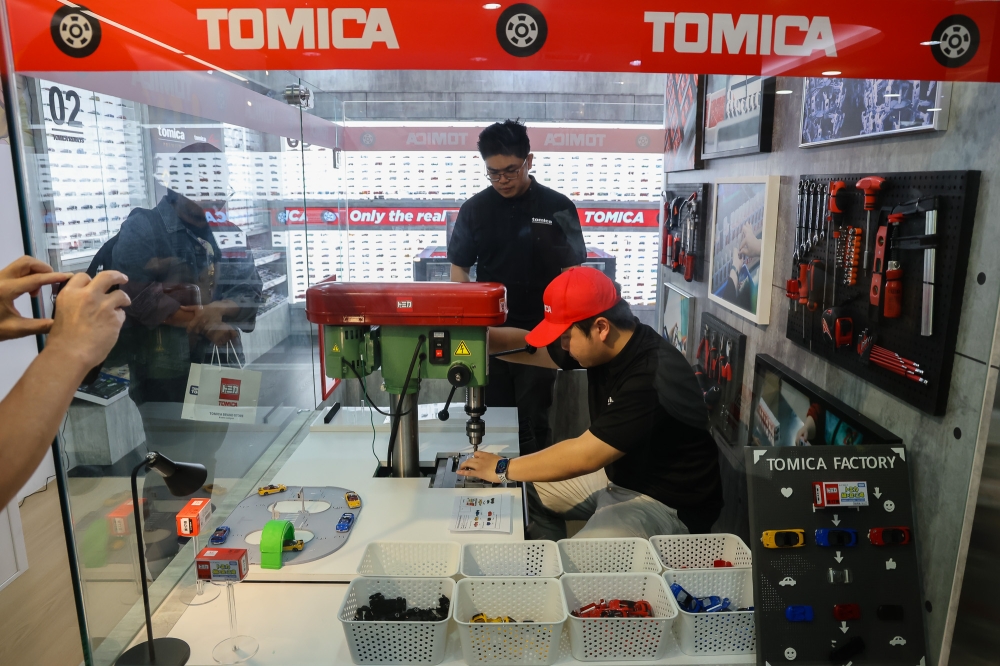 From selecting four parts, the Tomica miniature car is then sent to the staff who assemble it using a specialised machine before being tested and then packaged.