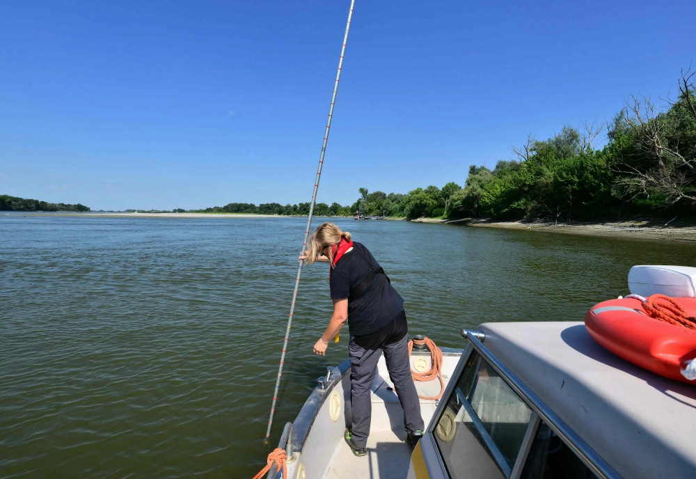 Daniela Cuochi, a member of the Interregional Agency for the Po River, measures the level of the Po River at Pontelagoscuro in northeast Italy on June 25, 2026. — AFP pic