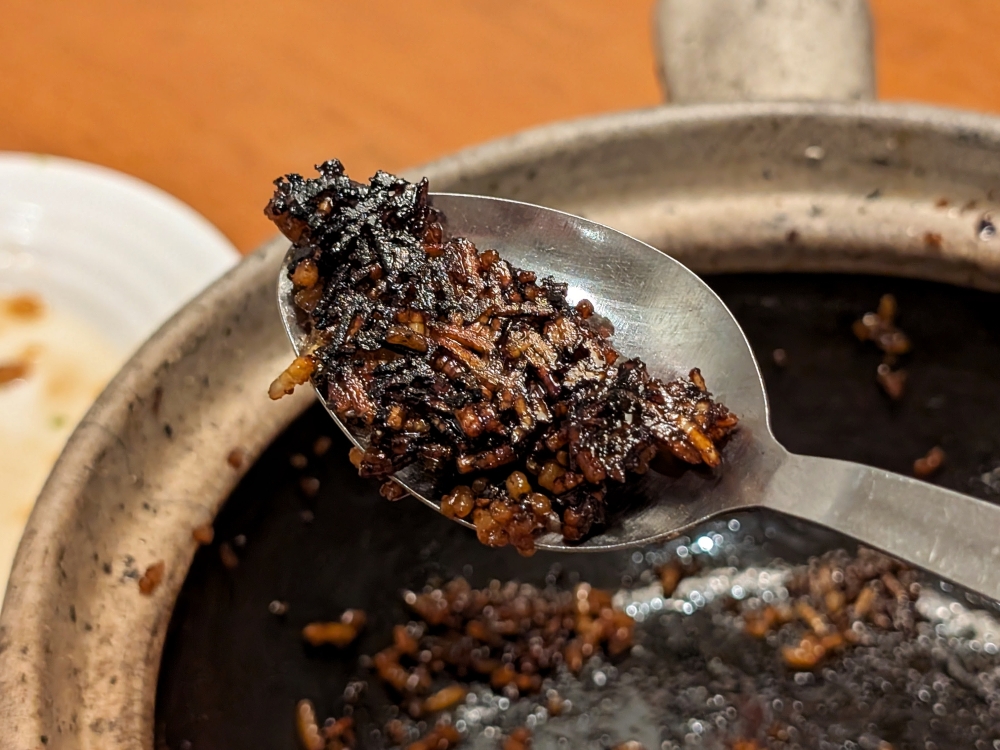 Black gold: the best part of any claypot chicken rice is the crisped, caramelised rice, or ‘fan jiuu’, left at the bottom. — Picture by Ethan Lau