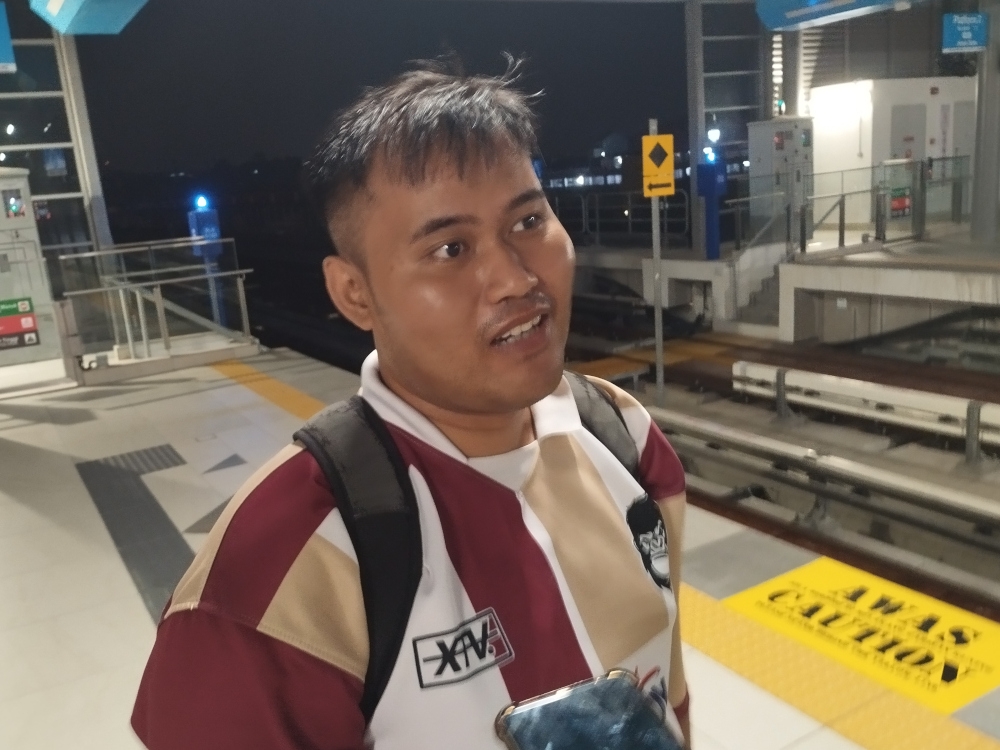 Qamarul, who was the first commuter to enter the Seksyen 7 Shah Alam LRT3 station, speaks to Malay Mail. — Picture by Muhammad Yusry