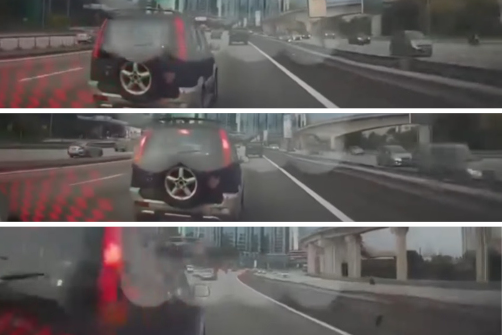Cops hunt Perodua Kembara driver after hit-and-run crash involving car, bike on Federal Highway (VIDEO)