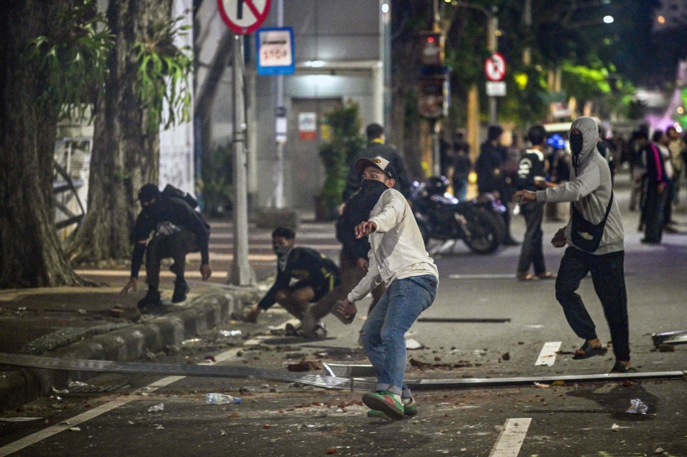 Indonesia charges four after fuel price protests turn violent