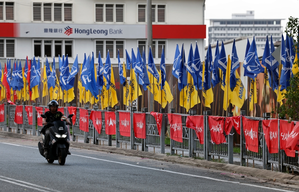 Party flags are seen in Johor Bahru ahead of the 16th Johor state election on July 11. The author argues that public election debates strengthen democracy by allowing voters to scrutinise competing leaders directly, rejecting the view that such exchanges are unnecessary or counterproductive. — Bernama pic