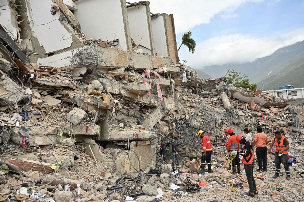 Rescuers work on search operations at the site of a collapsed building in Caraballeda, La Guaira state, Venezuela, on July 2, 2026. — AFP pic
