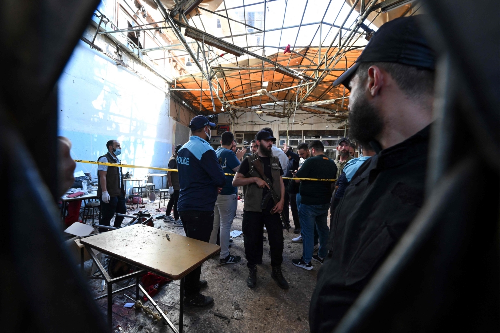 Ambulances race through Damascus after cafe bomb blast near courthouse kills nine, wounds 20 amid chaos