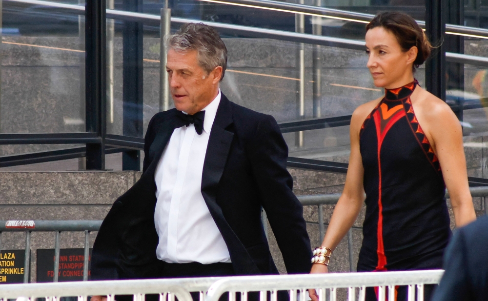 British actor Hugh Grant and Swedish producer Anna Elisabet Eberstein arrive at Madison Square Garden, the reported venue for the wedding celebrations of pop singer Taylor Swift and pro-athlete Travis Kelce, in New York City on July 3, 2026. — AFP pic