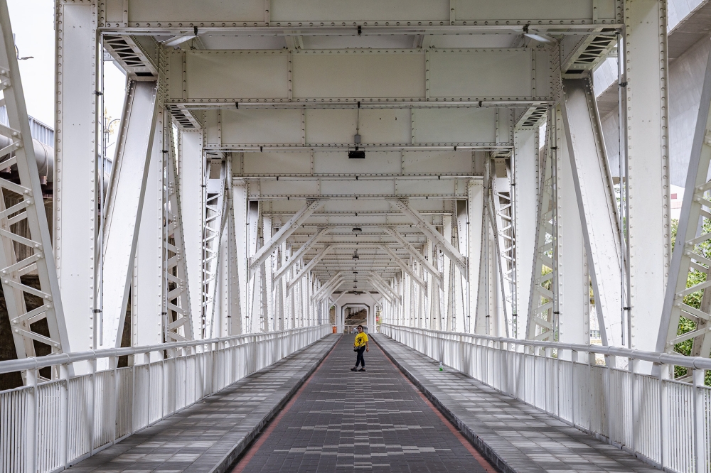 The historic Kota Bridge, Malaysia's first double-decker bridge, which spans the Klang River and gives the Jambatan Kota station its name. — Picture by Firdaus Latif