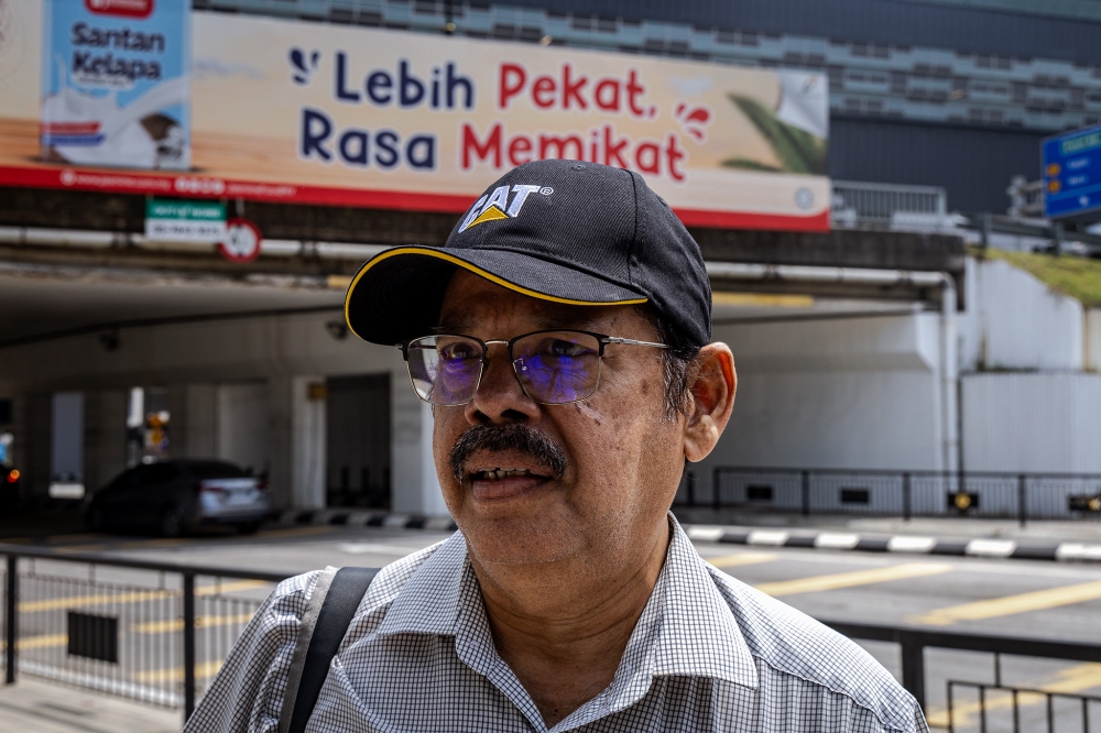 Subang Jaya resident Shashi Dharan, 69, said he and his son were taking advantage of the free rides to explore Klang. — Picture by Firdaus Latif