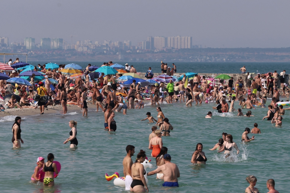 People swim in the Black Sea in Odesa on June 30, 2026, amid a European heat wave and the Russian invasion of Ukraine. The mercury could climb to 38C in Ukraine this week as Europe's deadly, record-breaking heatwave drifts eastward, engulfing the western half of the war-torn country. — AFP pic 
