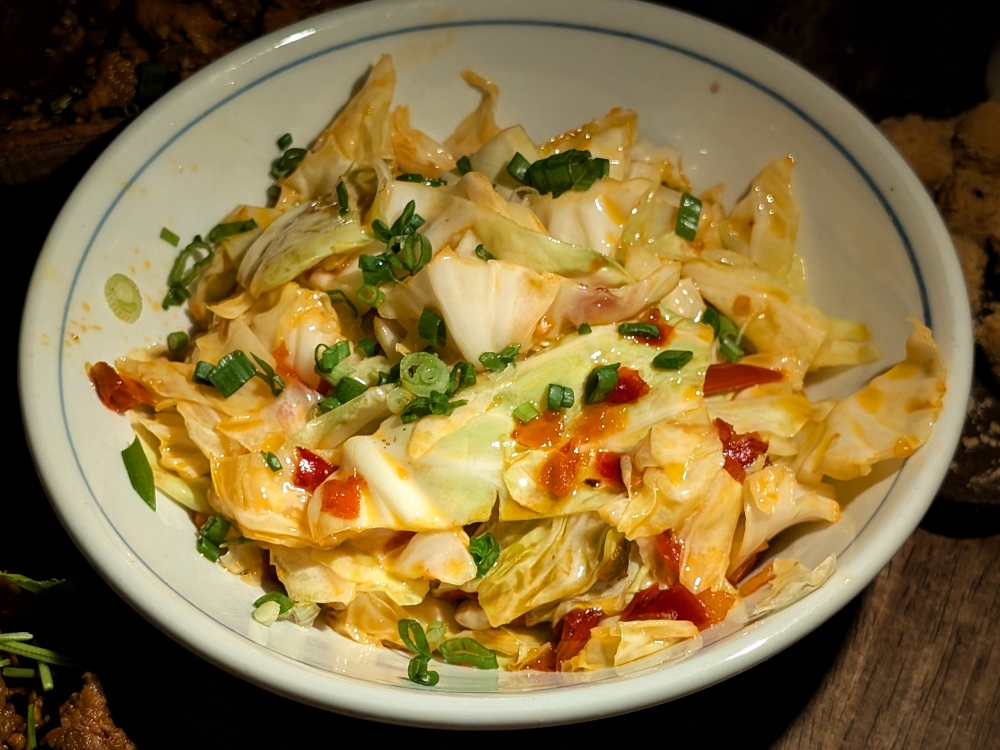 An intensely addictive portion of cabbage fried with fermented chillies. 