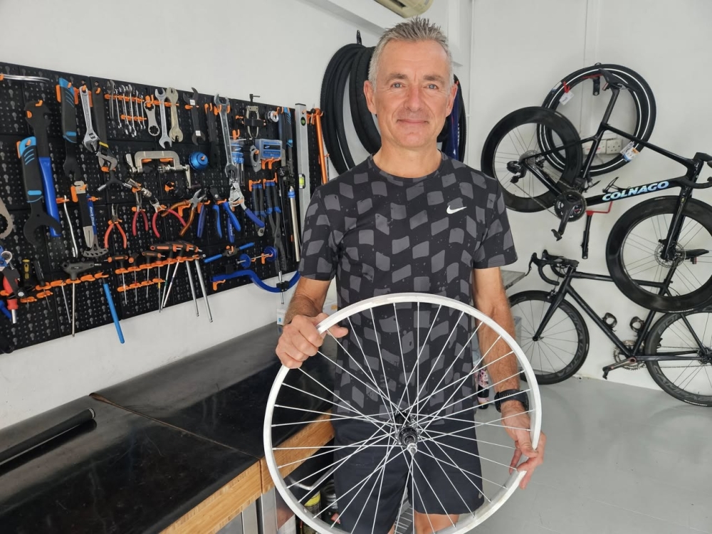 Reinvented: Ex-corporate leader Philip Mehl offers free bike repairs in Singapore for those who need them