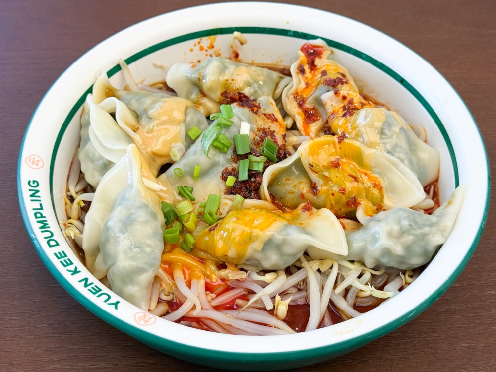 Shepherd’s Purse & Pork Dumplings are dressed with creamy peanut sauce and aromatic chilli oil, served over a base of crunchy bean sprouts. — Picture by Lee Khang Yi