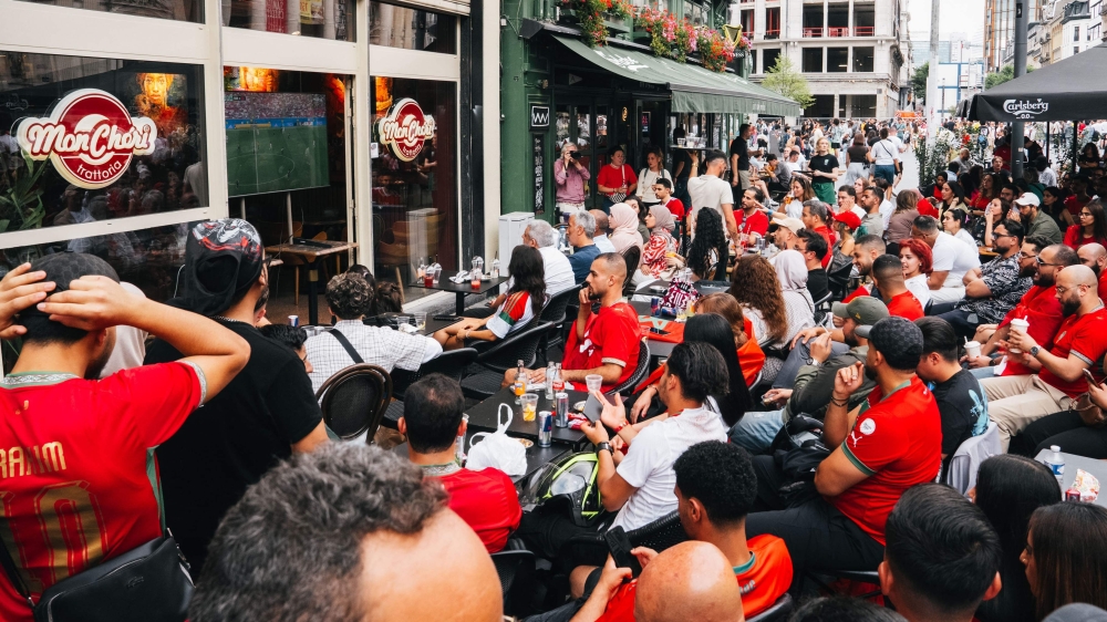 Supporters of Morocco sit at a bar terrace as they watch the 2026 World Cup round of 16 football match between Canada and Morocco, in Brussels on July 4, 2026. — AFP pic