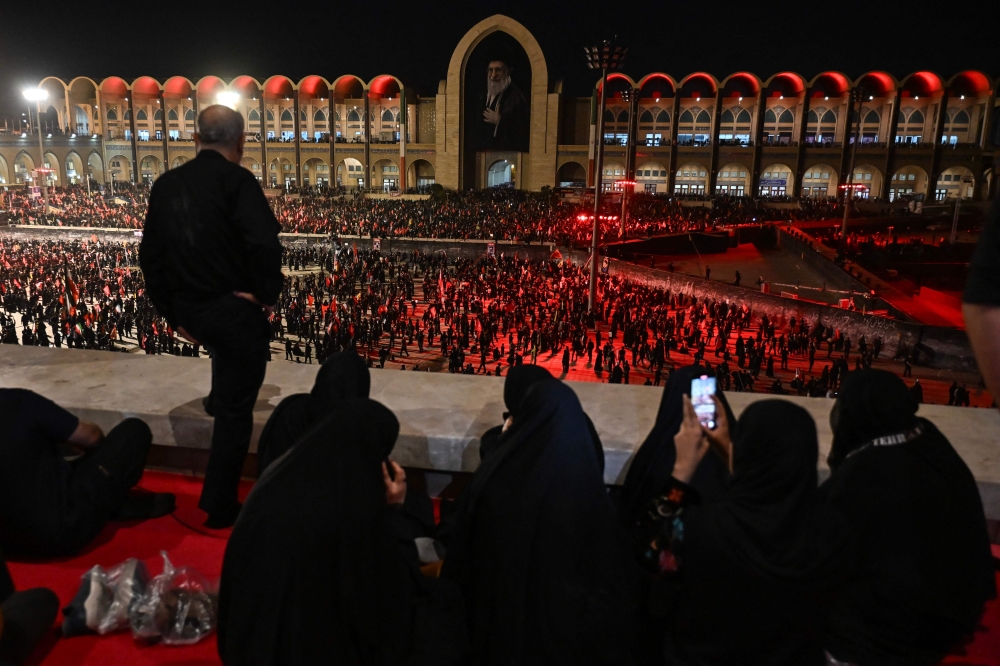 Calls to ‘have a drink’ ring out as Tehran funeral events take on fete‑like mood with free refreshments and electro music