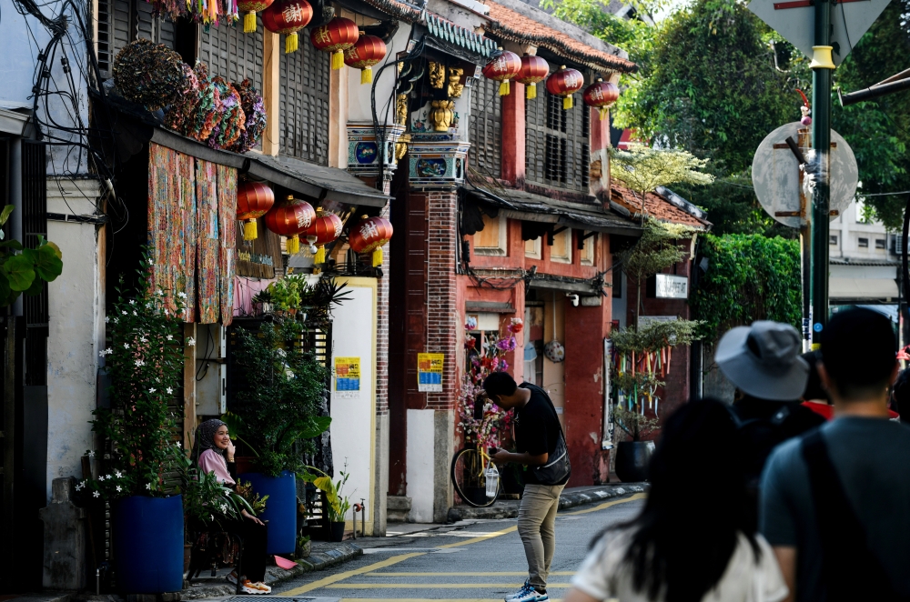Tourists visit the UNESCO World Heritage Site at Armenian Street in George Town on July 7, 2026. — Bernama pic