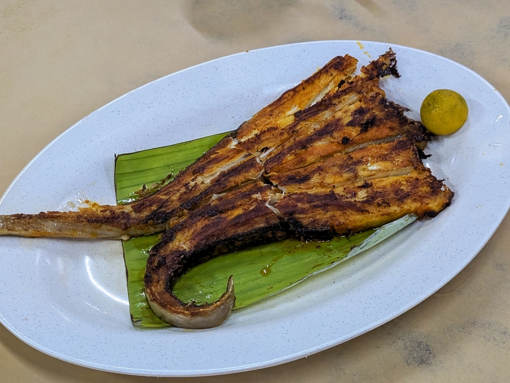 The unique muscle fibres in stingray make it ideal for ‘ikan bakar’ as the long, firm threads of flesh peel off the cartilage with succulent ease. — Picture by Ethan Lau