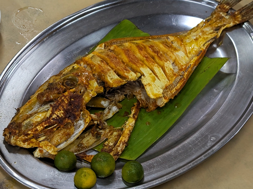 It looks gnarly and has a funny name, ‘ikan ayam’ lives up to its name when grilled in this style. — Picture by Ethan Lau