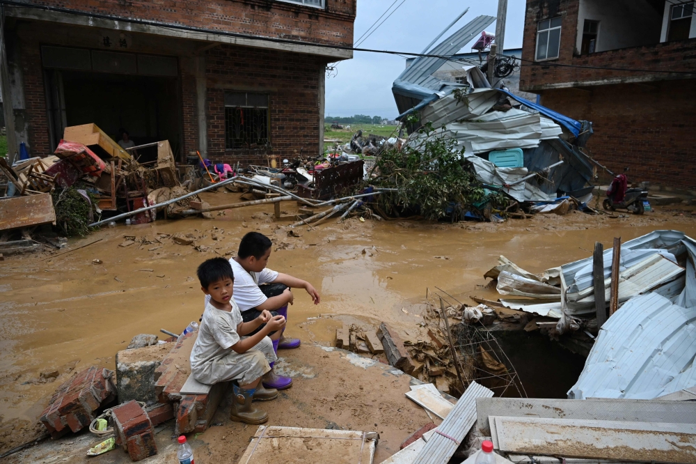 In China, deadly floods and dam collapse kill 17 as super typhoon Bavi looms