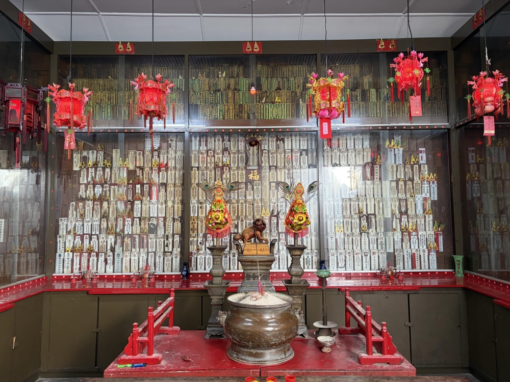 The ancestral tablet hall where members offer prayers to their ancestors; red lanterns are hung up to celebrate the birth of baby boys in a member’s family. — Picture by Opalyn Mok