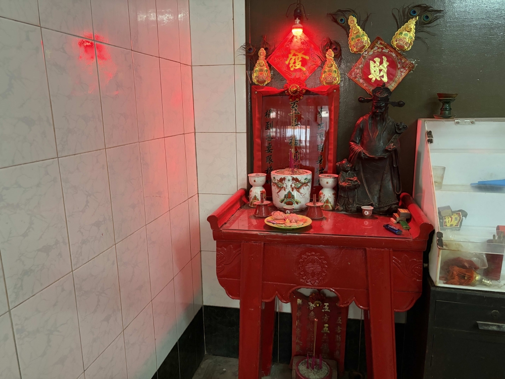 An altar dedicated to Zhi Sin Zhou Sin, honouring a martial arts master. — Picture by Opalyn Mok