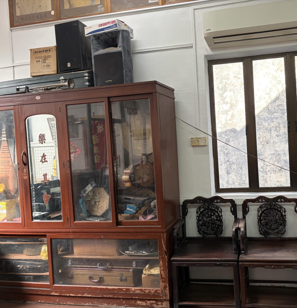 Musical instruments from a long gone era are locked in a cabinet at the association. — Picture by Opalyn Mok