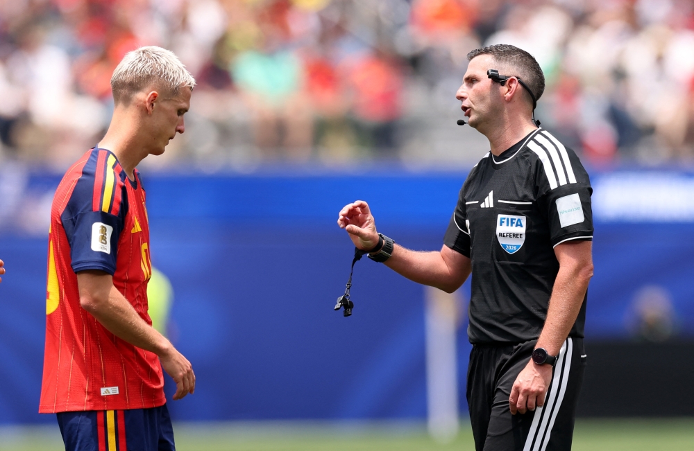 Referee Michael Oliver speaks with Dani Olmo #10 of Spain during the FIFA World Cup 2026 Quarter Final match between Spain and Belgium at Los Angeles Stadium on July 10, 2026 in Inglewood, California. — Getty Images via AFP pic