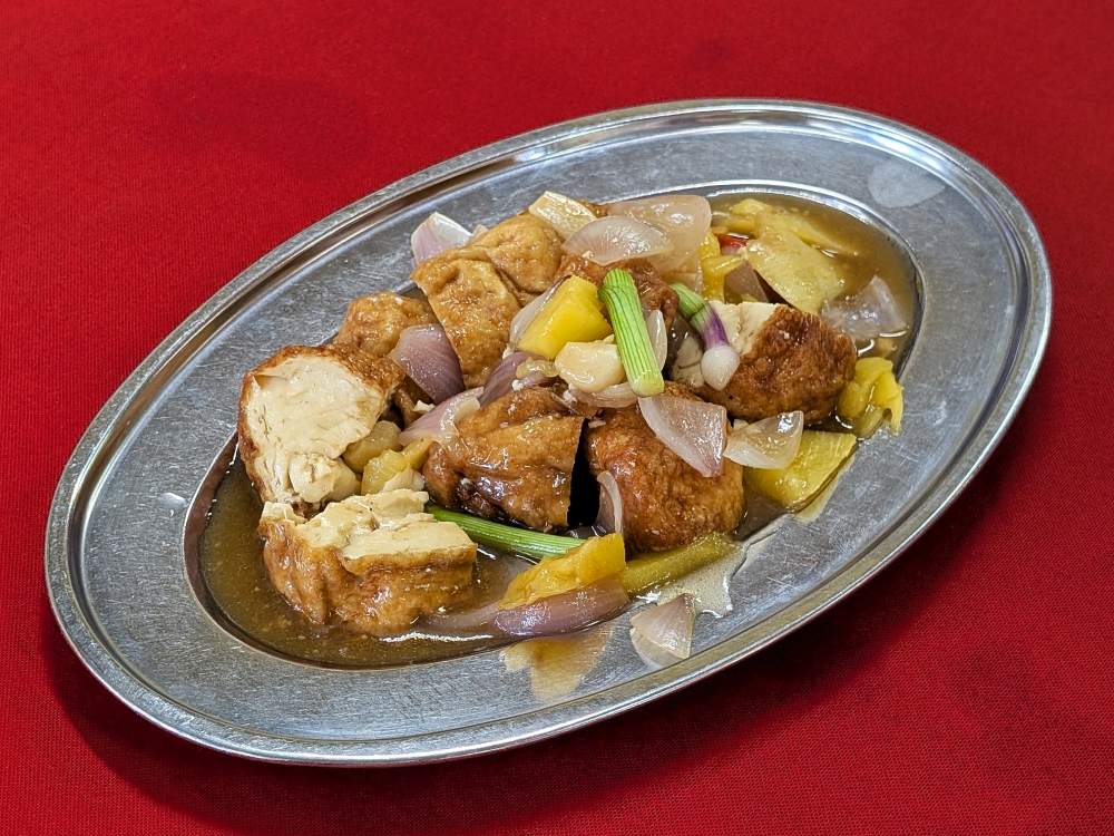 Pineapple tofu is a scarcely seen but interesting preparation that adds a tangy dimension to the dish. — Picture by Ethan Lau