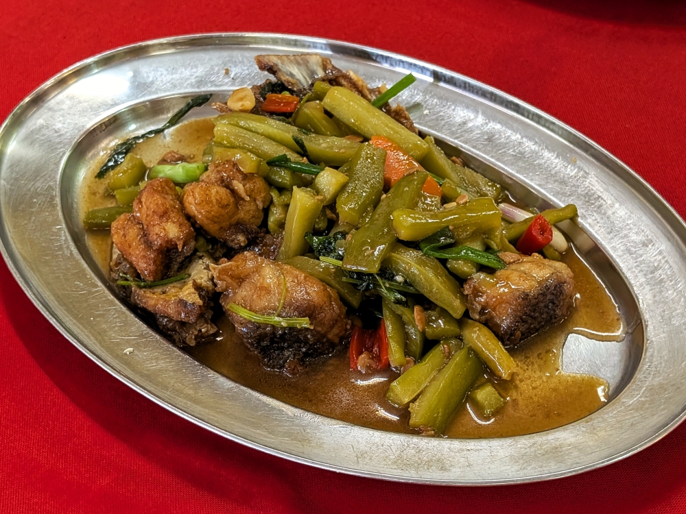 The braised grouper with bitter gourd is light on just about every other flavour, which allows the gourd’s earthiness to come through. — Picture by Ethan Lau